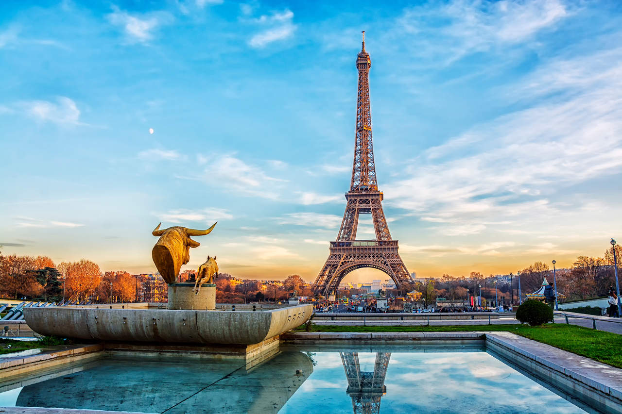 Eiffel Tower at sunset in Paris, France. Romantic travel background